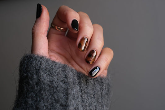 A hand with water marble nails