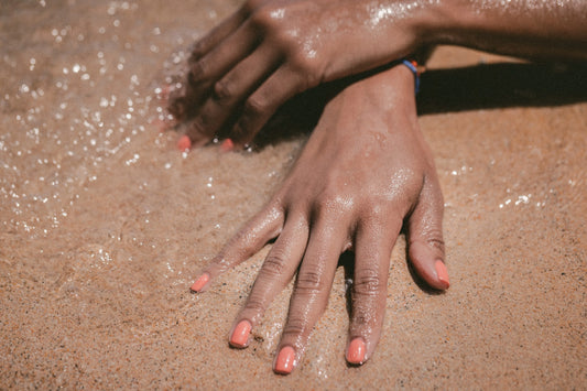 A hand in the sand
