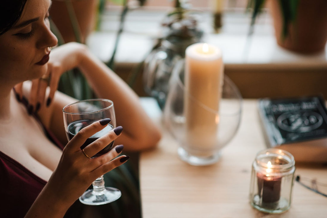 A woman sipping a drink