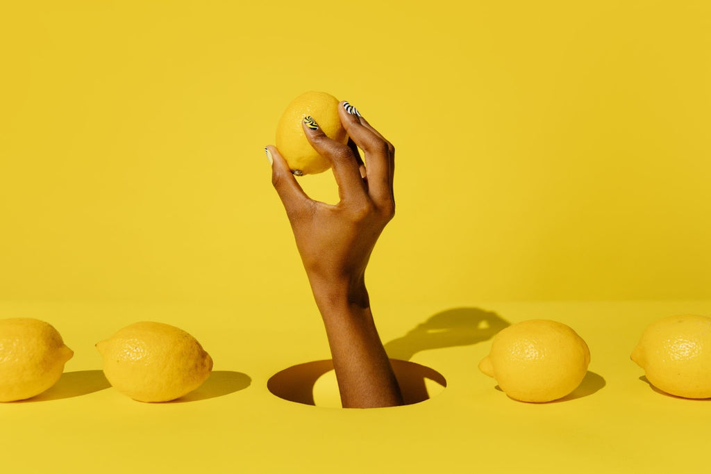 Someone holding a lemon