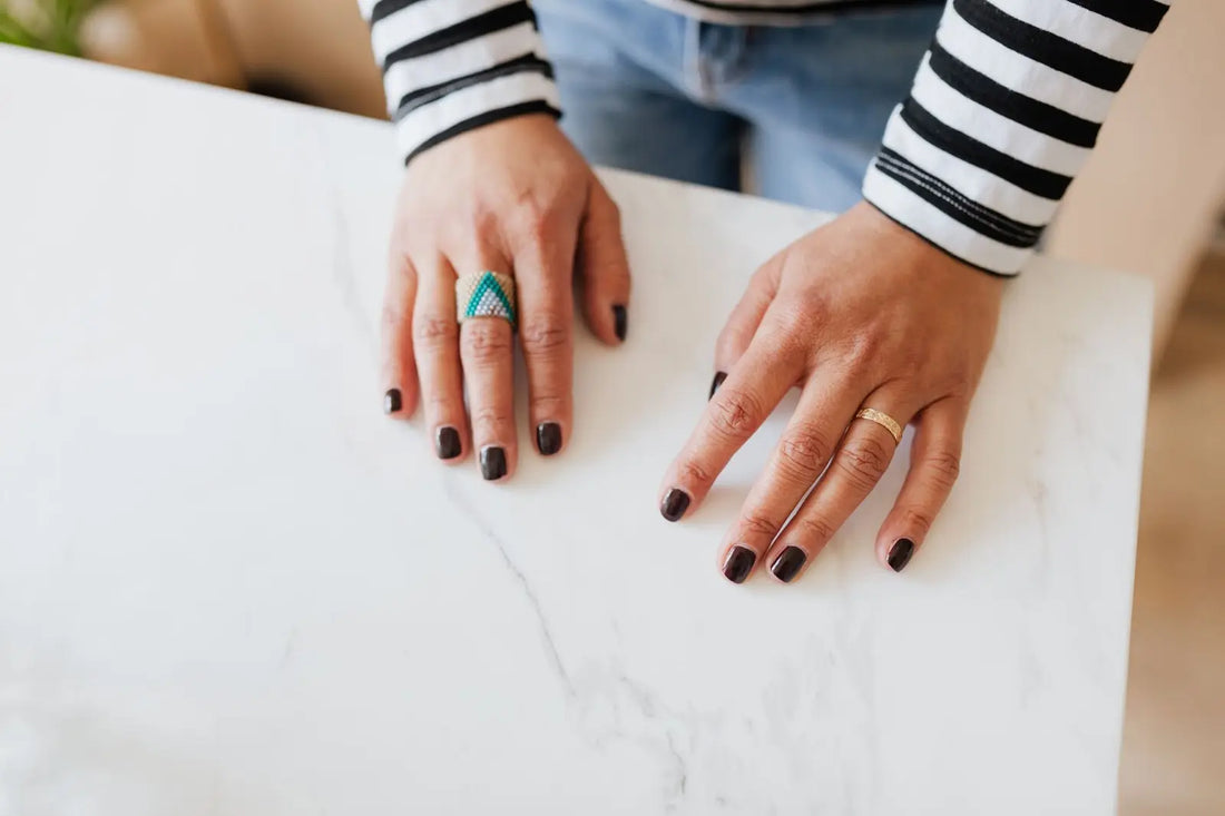 A woman with painted fingernails