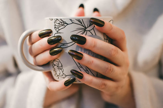 A woman drinking out of a cup