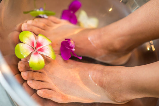 A woman with her feet in water