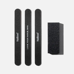Four black nail files and a rectangular nail buffer.