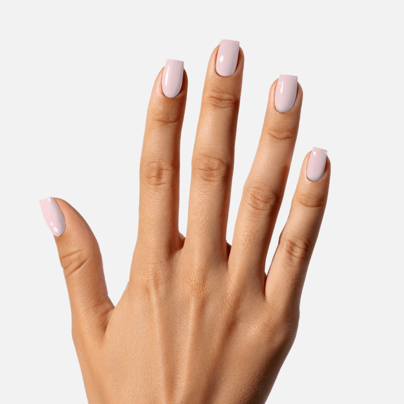 Hand with light pink polished nails against a white background.