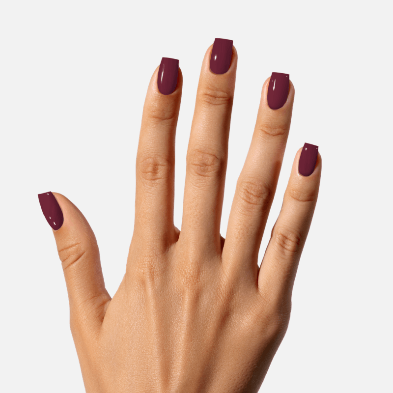 Woman Hand With Long Nails And A Bottle Of Dark Red Burgundy Nail Polish  Stock Photo, Picture and Royalty Free Image. Image 151969324.